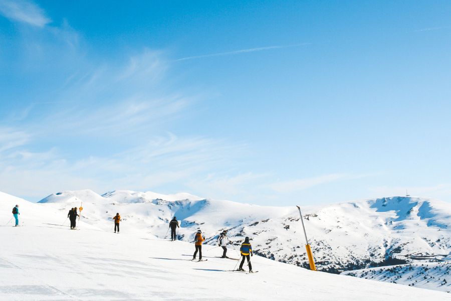 image shows skiiers and snowboarders on a mountain