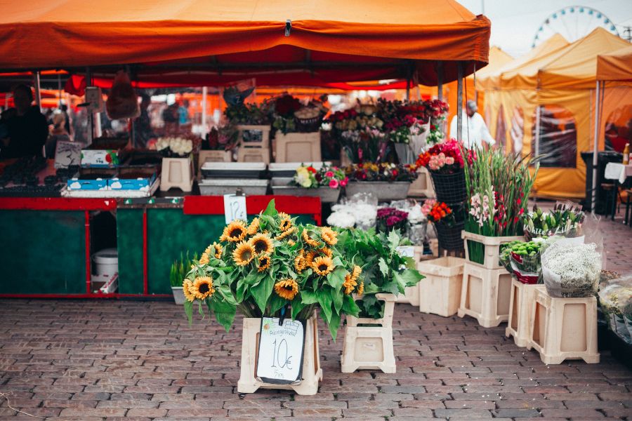 image shows flowers at a market